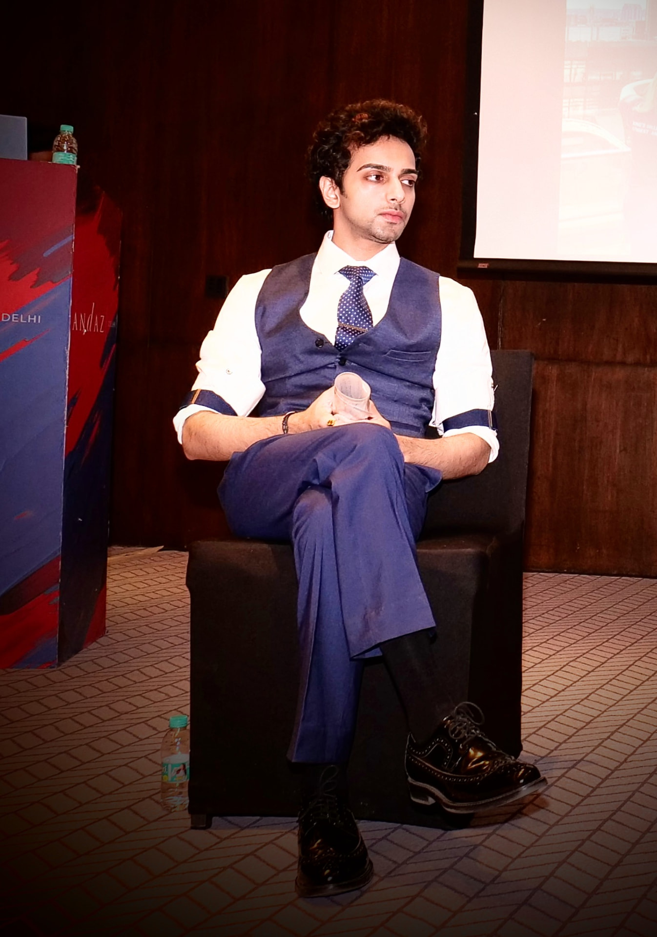 Sabyasachi Moulik seated on a panel discussion stage